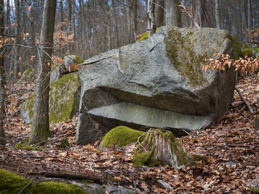 A boulder from which something has been cleanly cut out