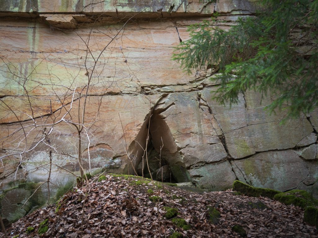 Triangular opening beneath a sandstone wall at the historic Jägerhaus quarry near Heilbronn.