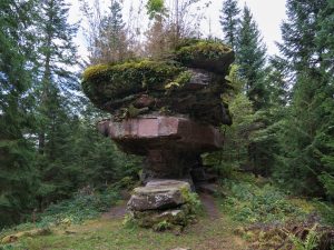 The moss-covered Kastelstein sandstone table in the Black Forest